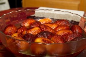 Allow the gulab jamun to stand at room temperature while the syrup is absorbed.
